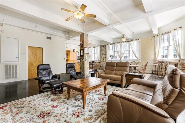 living room featuring hardwood / wood-style flooring, plenty of natural light, ceiling fan, and beam ceiling