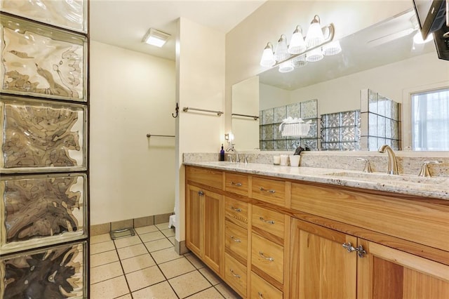 bathroom featuring tile patterned flooring and vanity