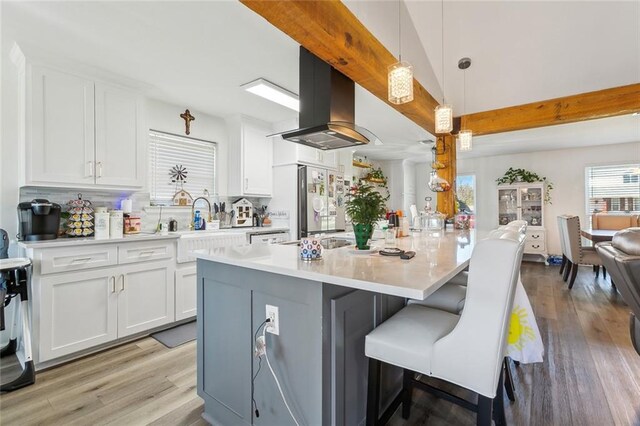 dining space featuring hardwood / wood-style floors and a notable chandelier