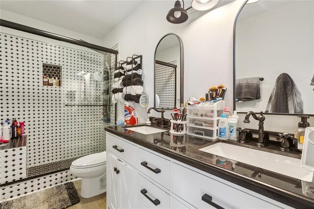 bathroom with vanity and hardwood / wood-style floors