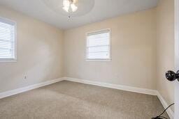 carpeted empty room featuring a healthy amount of sunlight