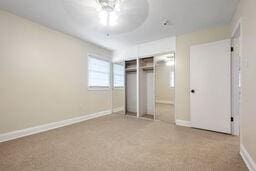 unfurnished bedroom with a closet