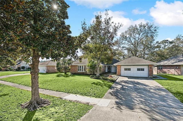 ranch-style house featuring a garage and a front yard