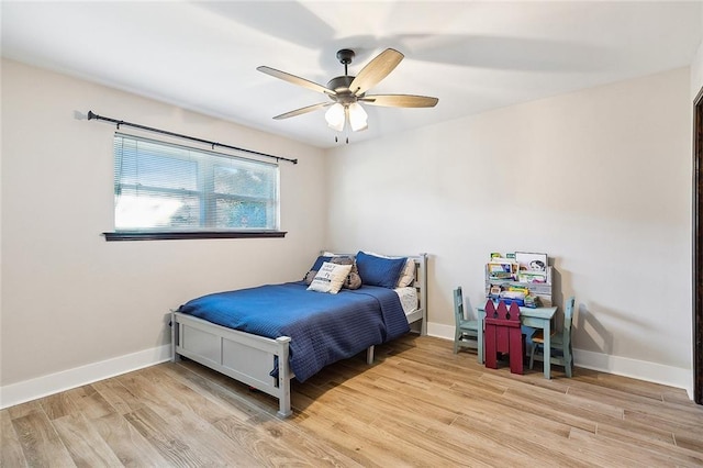 bedroom featuring ceiling fan and light hardwood / wood-style floors