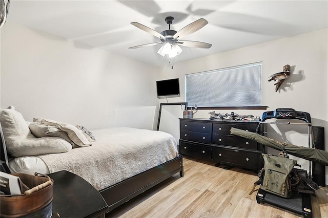 bedroom featuring ceiling fan and light hardwood / wood-style flooring