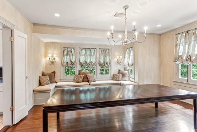 interior space featuring hardwood / wood-style floors, a wealth of natural light, and a notable chandelier