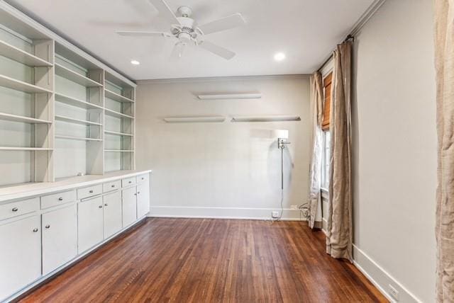 interior space with white cabinetry, ceiling fan, and dark hardwood / wood-style floors