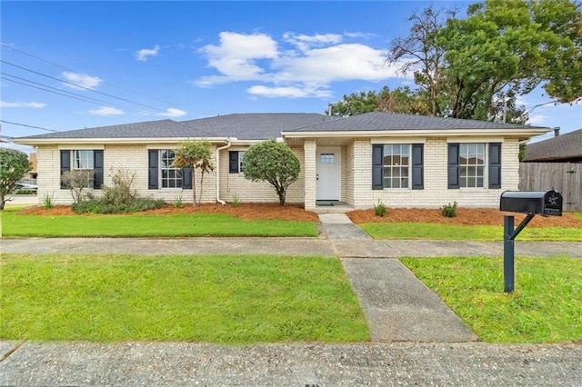 ranch-style house with a front yard