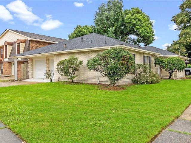 view of property exterior featuring a garage and a lawn