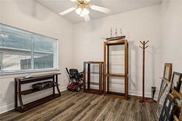 miscellaneous room featuring ceiling fan and dark wood-type flooring