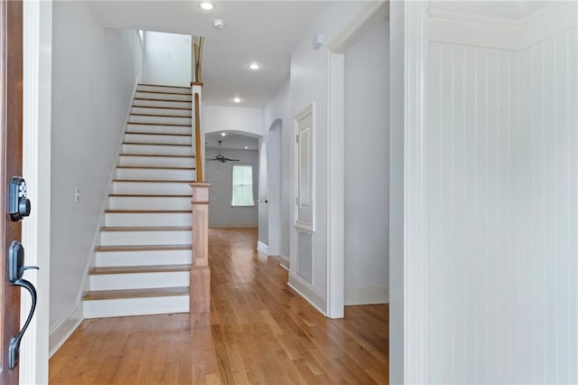 foyer entrance with light hardwood / wood-style flooring and ceiling fan