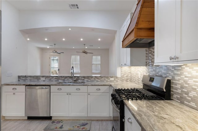 kitchen with sink, white cabinetry, and stainless steel appliances