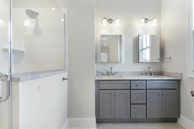 bathroom with tile patterned flooring, vanity, and an enclosed shower