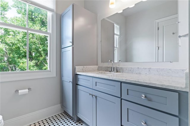 bathroom with tile patterned flooring and vanity