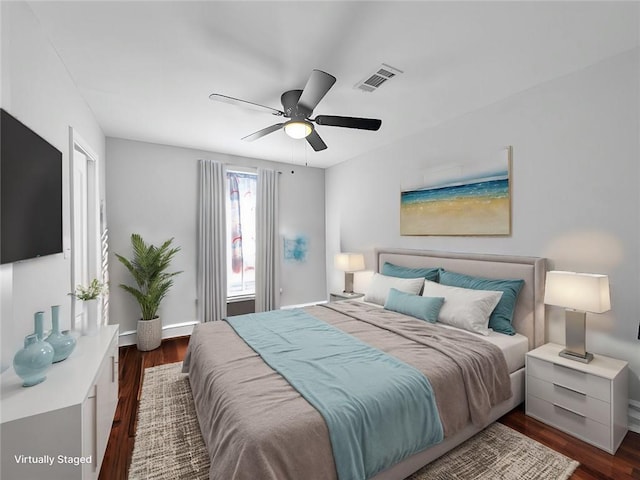 bedroom featuring ceiling fan and dark wood-type flooring