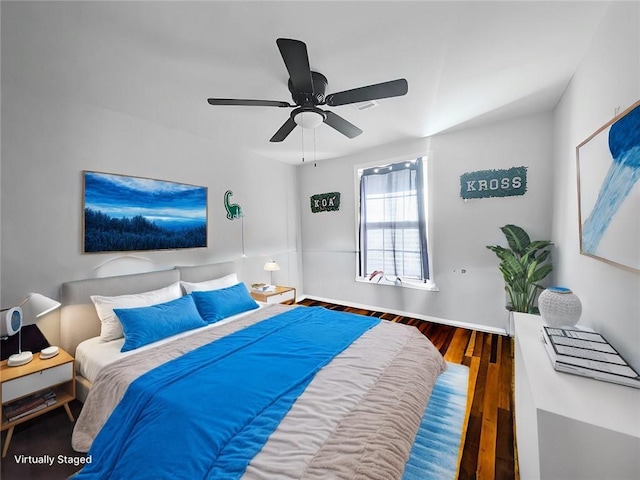 bedroom with ceiling fan and dark hardwood / wood-style flooring