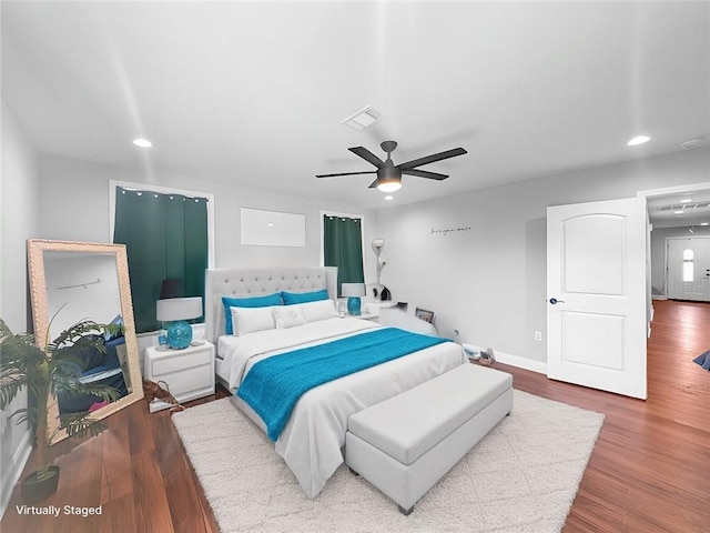 bedroom with hardwood / wood-style flooring and ceiling fan