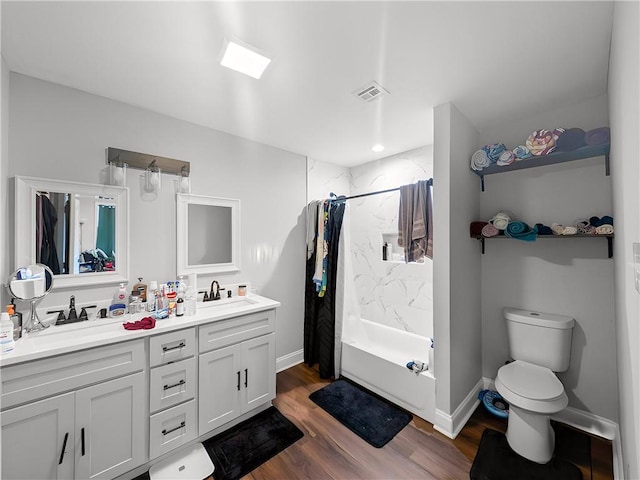 bathroom with wood-type flooring, toilet, vanity, and a shower with curtain