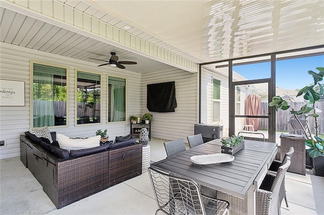 view of patio with an outdoor living space, outdoor dining area, and a ceiling fan