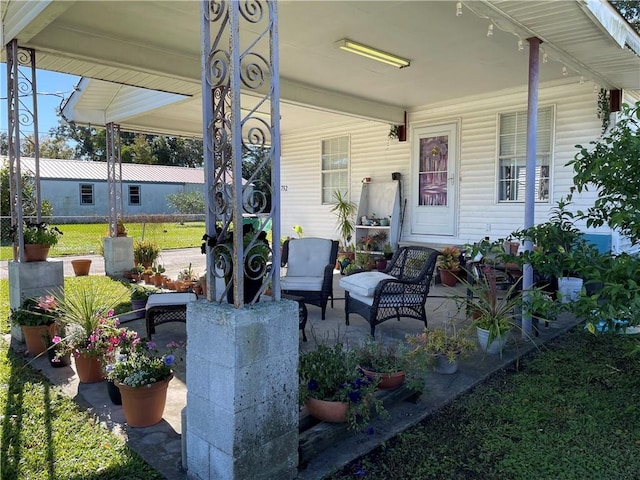 view of patio featuring a porch