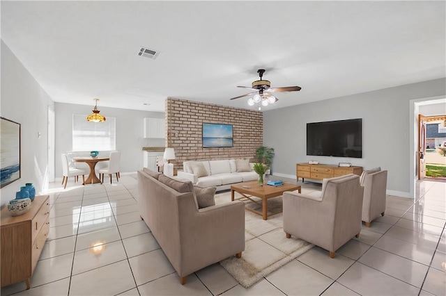 living room with ceiling fan and light tile patterned flooring