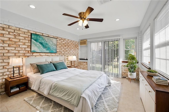 tiled bedroom with access to exterior, ceiling fan, and brick wall