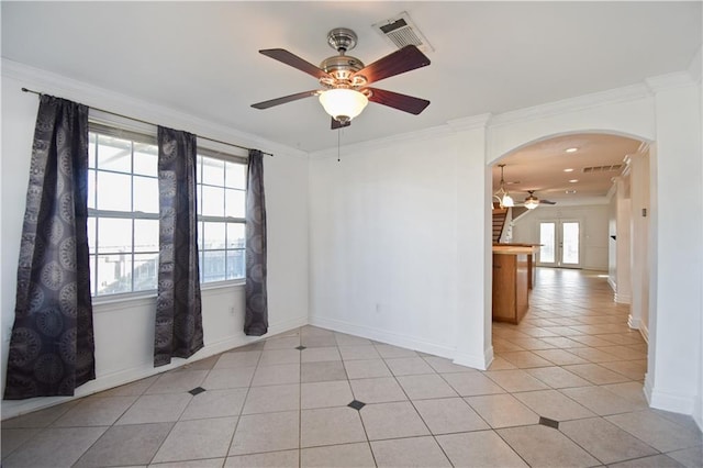 3000 Arlington St, Jefferson, LA 70121 - empty room with a ceiling fan, arched walkways, ornamental molding, plenty of natural light, and light tile patterned floors