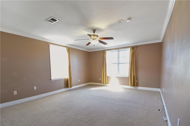 unfurnished room featuring ceiling fan, light colored carpet, and ornamental molding