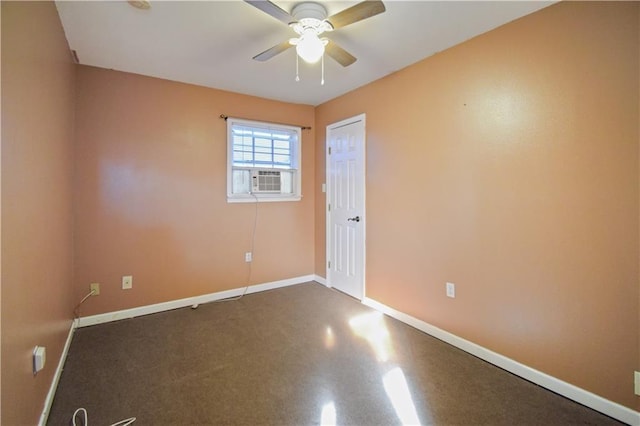 spare room featuring ceiling fan and cooling unit