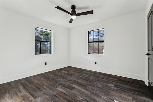 unfurnished room with ceiling fan and dark hardwood / wood-style floors