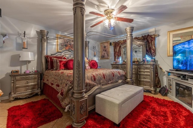 bedroom with ceiling fan and light tile patterned floors