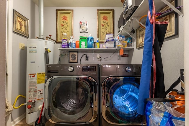 laundry area with washer and clothes dryer and water heater