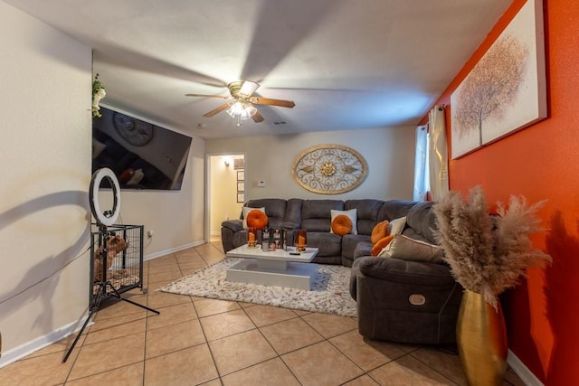 tiled living room with ceiling fan