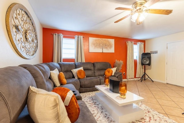 living room with ceiling fan and light tile patterned floors