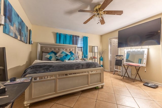 tiled bedroom with ceiling fan