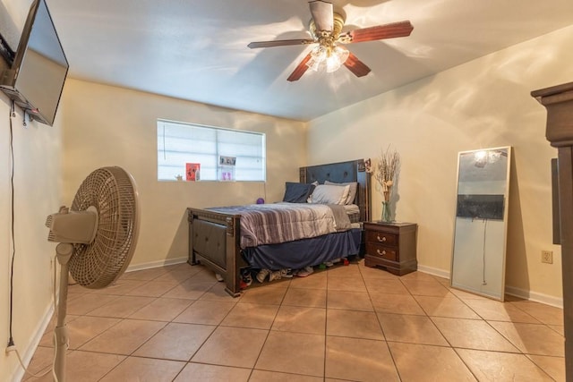 tiled bedroom featuring ceiling fan