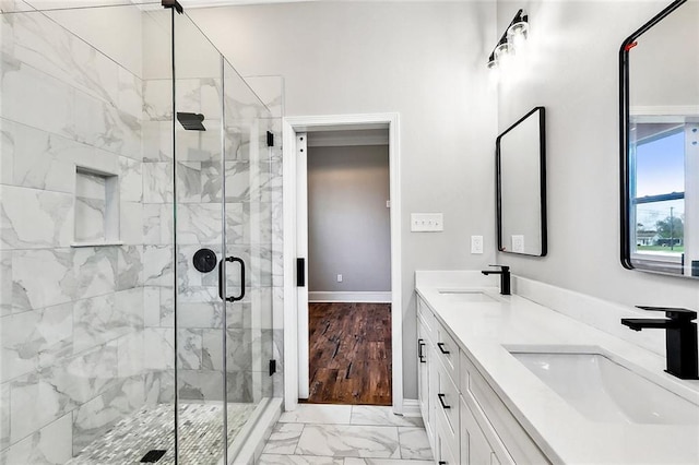 bathroom featuring vanity and a shower with shower door