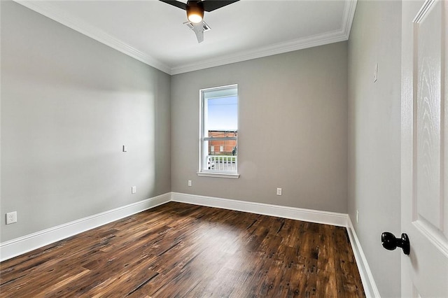 spare room with crown molding, dark wood-type flooring, and ceiling fan