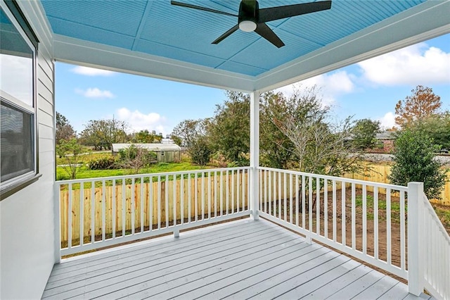 wooden terrace featuring ceiling fan