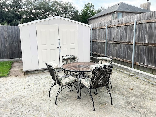 view of patio / terrace with a storage shed