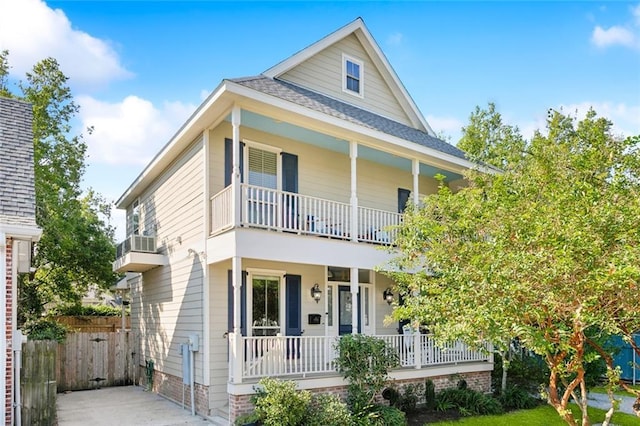 view of front of house featuring a balcony and a porch