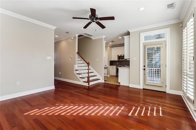 unfurnished living room featuring ceiling fan, dark hardwood / wood-style flooring, and crown molding