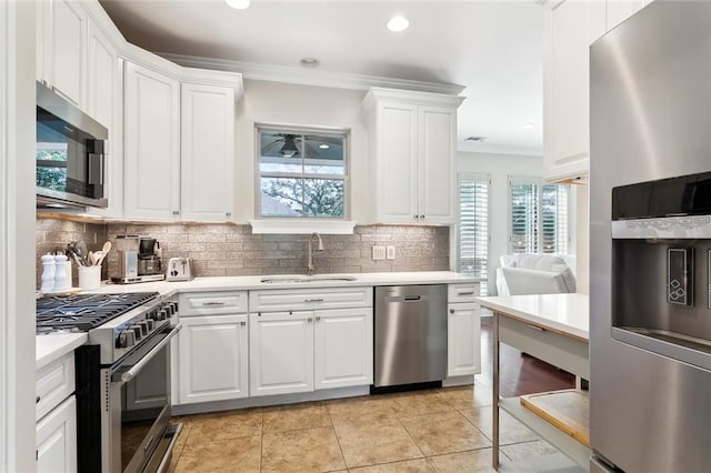 kitchen featuring white cabinetry, sink, and stainless steel appliances