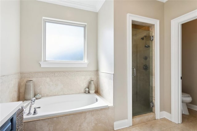 full bathroom featuring shower with separate bathtub, vanity, toilet, and crown molding