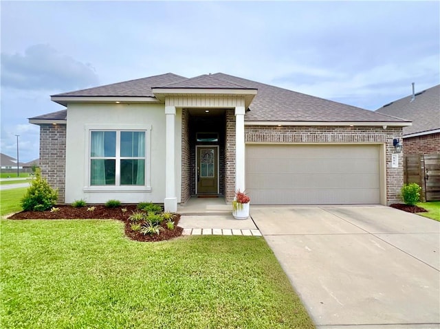 view of front facade featuring a garage and a front yard