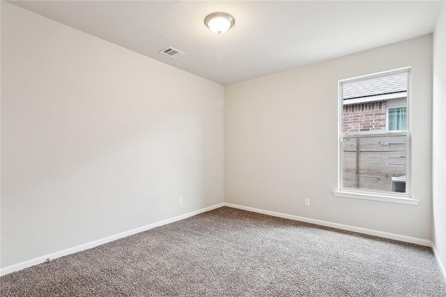 empty room featuring carpet flooring