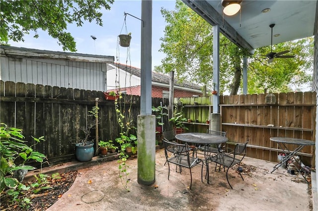 view of patio featuring ceiling fan