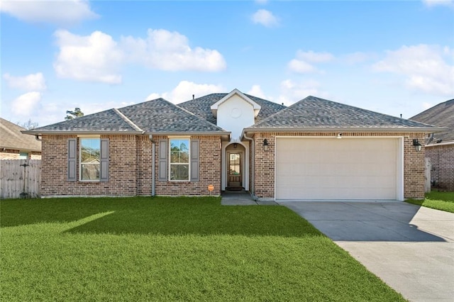 single story home with a front yard and a garage