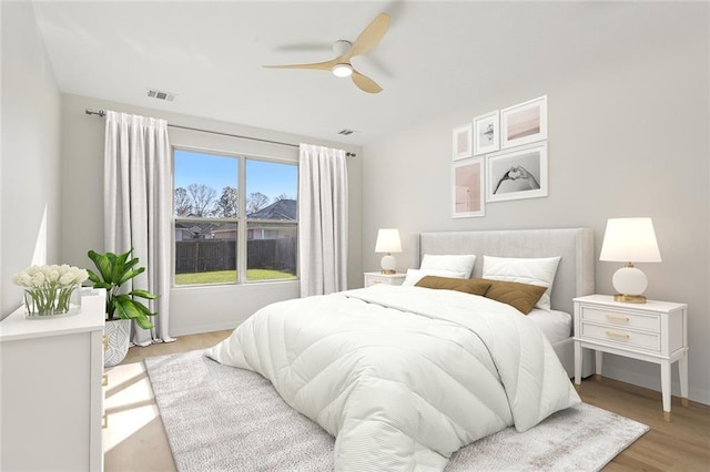 bedroom featuring ceiling fan and light hardwood / wood-style floors