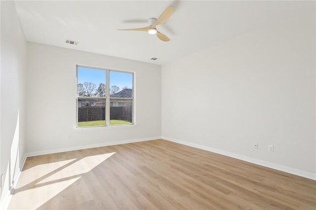 spare room with ceiling fan and light hardwood / wood-style flooring